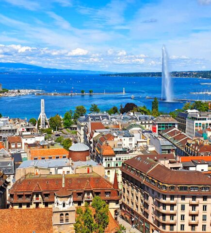 Aerial view of Geneva and Lake Geneva, home to TotalEnergies’ European hub as a leading energy trading firm.